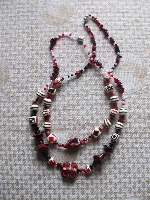 Jewelry: Two necklaces red and black